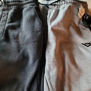 2 pairs of men's large sweats both tapered at the ankle , pony brand is new
